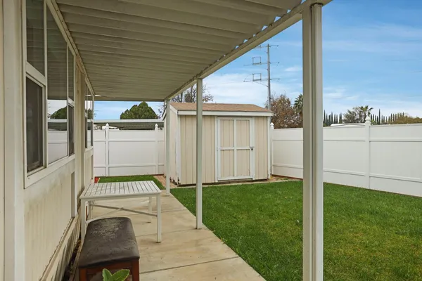 a view of a backyard with cabin