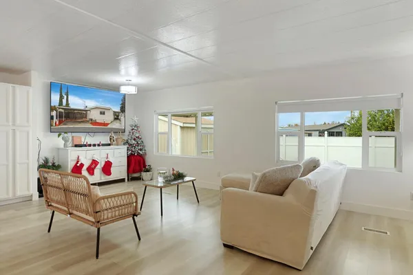 a living room with furniture and a window