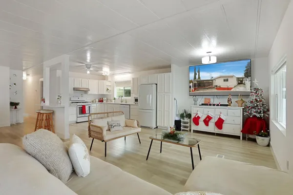 a living room with lots of furniture and white walls