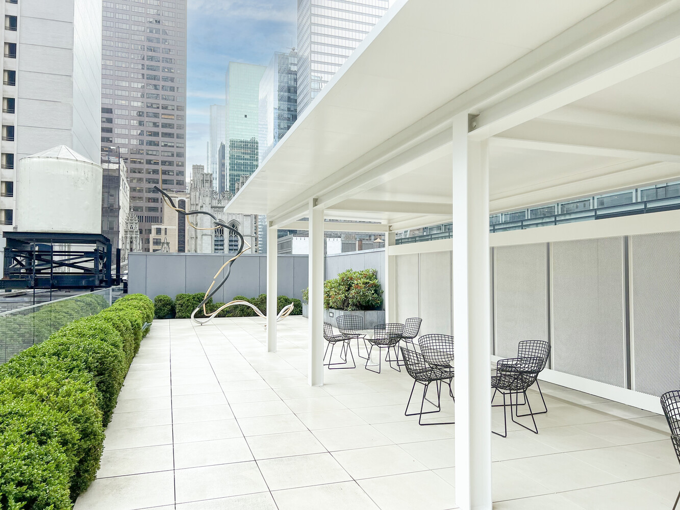15 West 53rd Street, Unit 46AF Manhattan, NY 10019 - Photo 13 of 17 a building outdoor space with patio furniture and garden