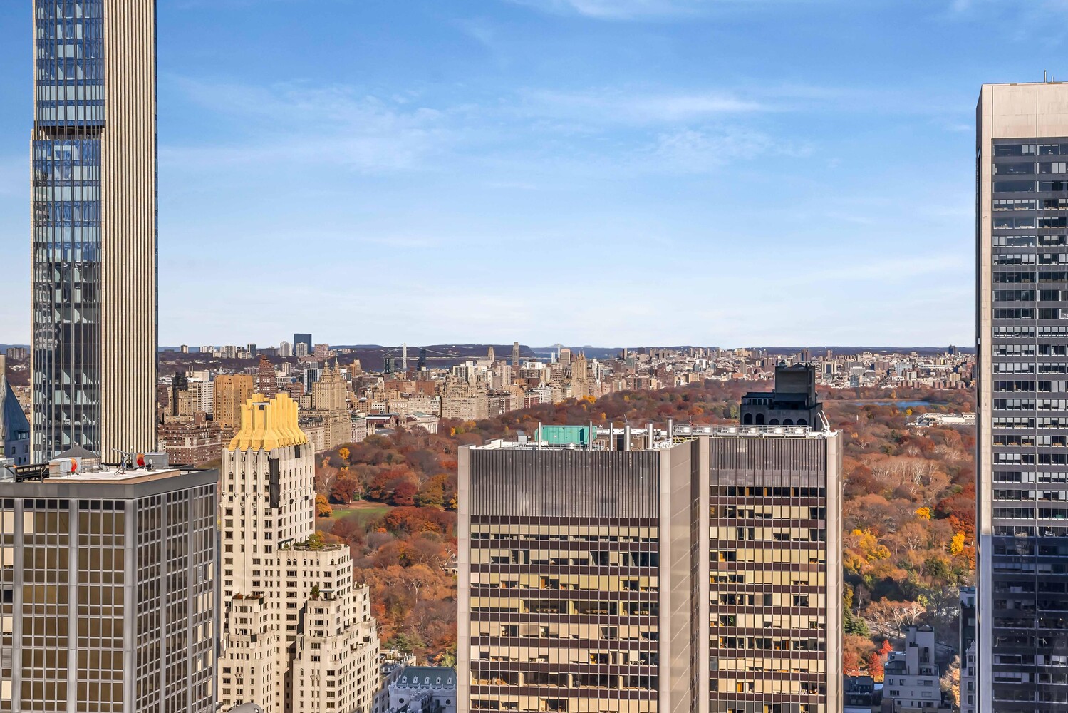15 West 53rd Street, Unit 46AF Manhattan, NY 10019 - Photo 5 of 17 a view of a city with tall buildings