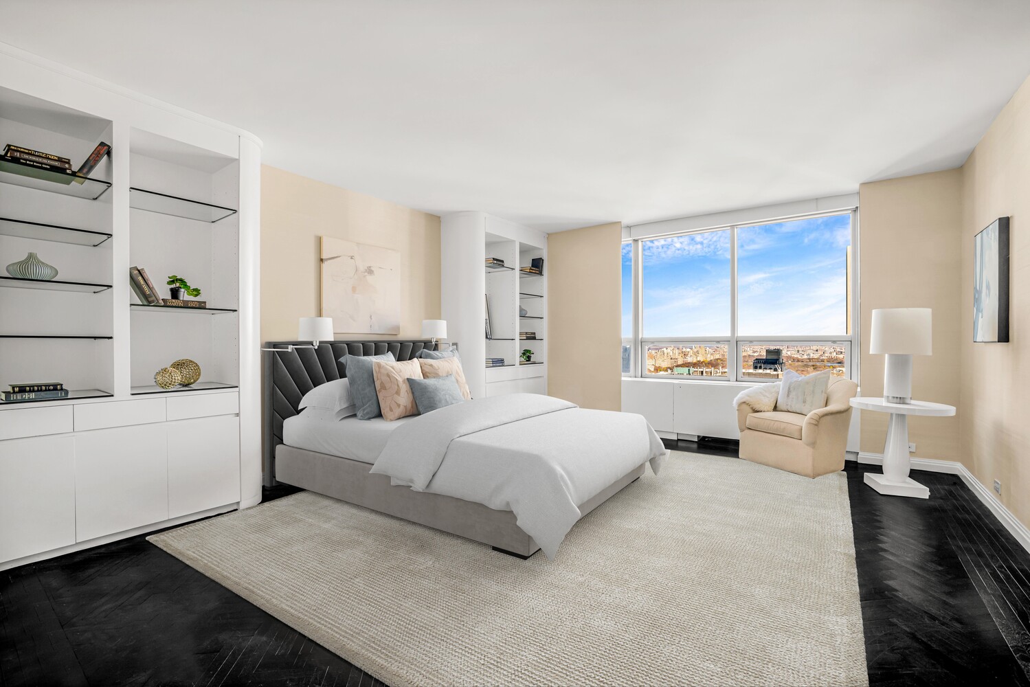 15 West 53rd Street, Unit 46AF Manhattan, NY 10019 - Photo 9 of 17 a spacious bedroom with a bed and a large window