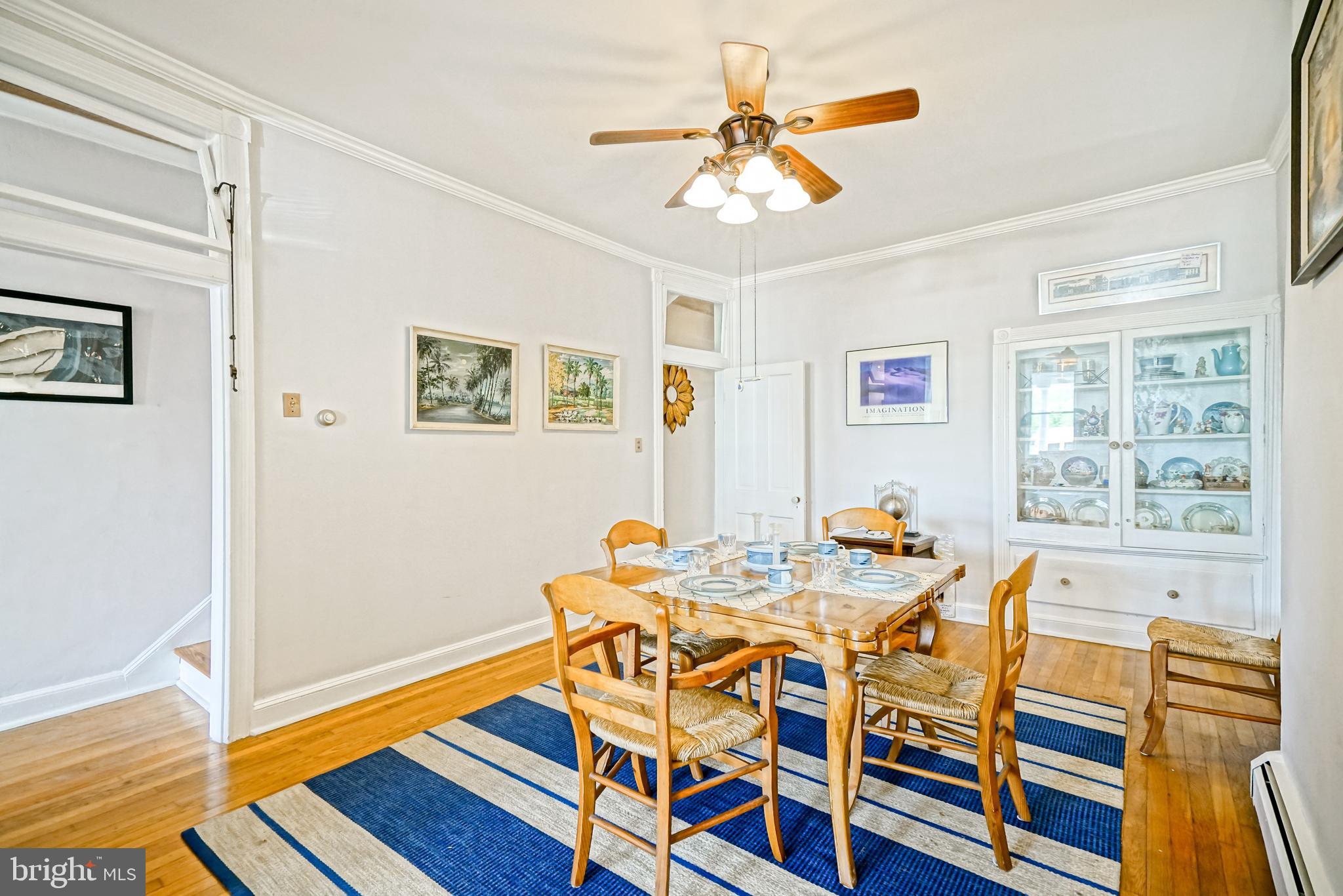 407 Savannah Road Lewes, DE 19958 - Photo 13 of 44 a view of a dining room with furniture and wooden floor