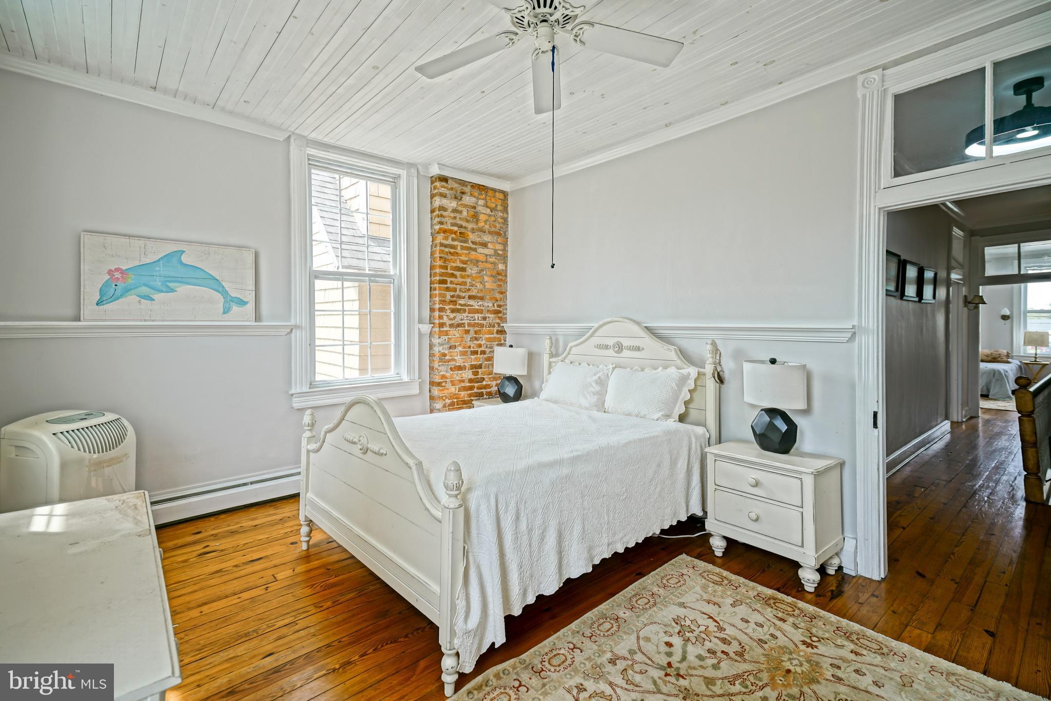 407 Savannah Road Lewes, DE 19958 - Photo 25 of 44 a bedroom with a bed and a window