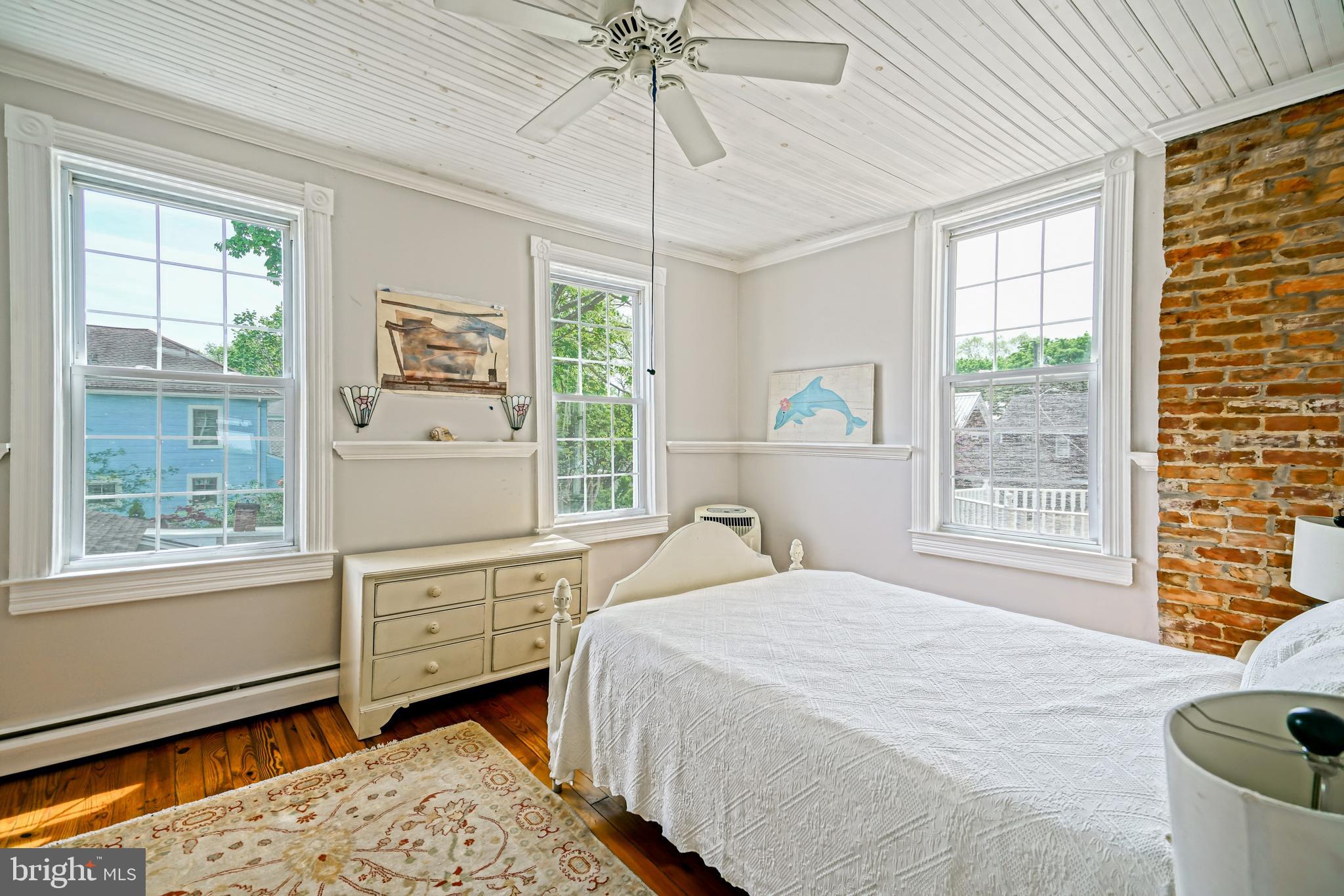 407 Savannah Road Lewes, DE 19958 - Photo 26 of 44 a bedroom with a bed dresser and a window