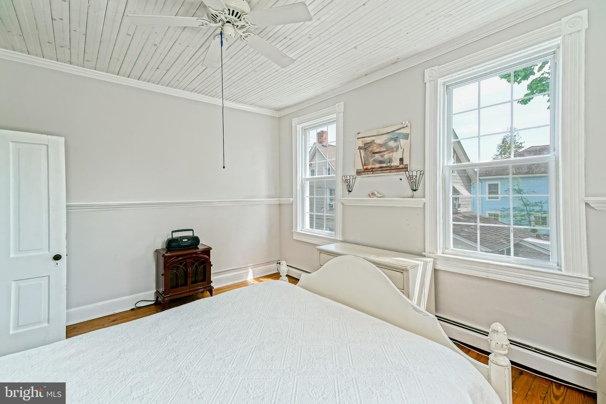 407 Savannah Road Lewes, DE 19958 - Photo 27 of 44 a room with a bed and a window
