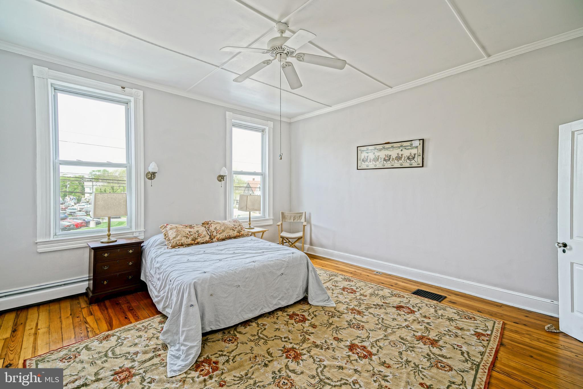 407 Savannah Road Lewes, DE 19958 - Photo 36 of 44 a bedroom with a bed and a window
