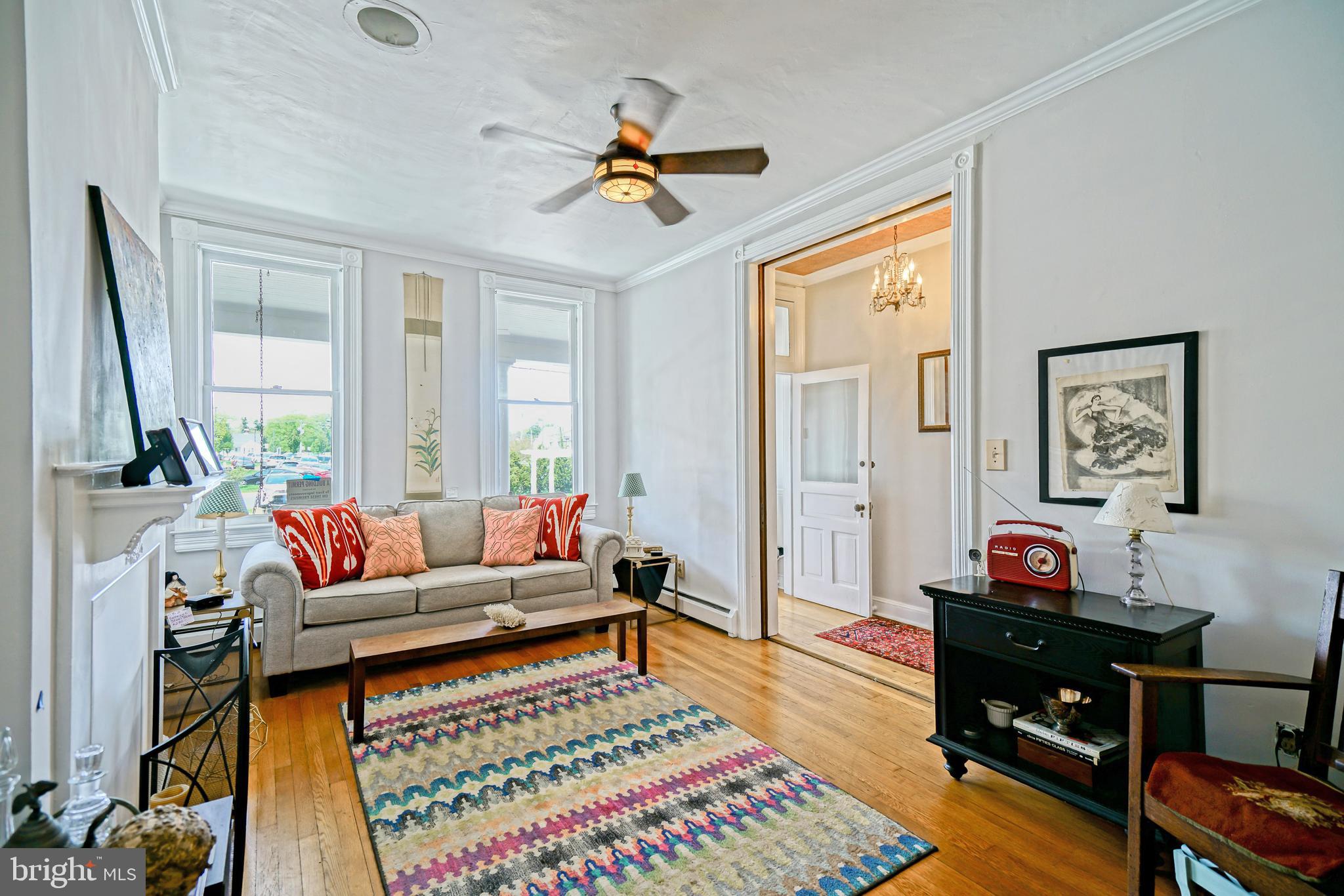 407 Savannah Road Lewes, DE 19958 - Photo 5 of 44 a living room with furniture and a rug
