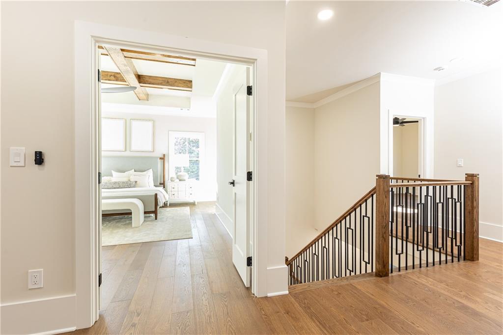 1967 Highgrove Court Decatur, GA 30033 - Photo 18 of 25 a view of a hallway with wooden floor and a living room