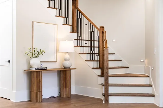 a view of entryway and hall with wooden floor