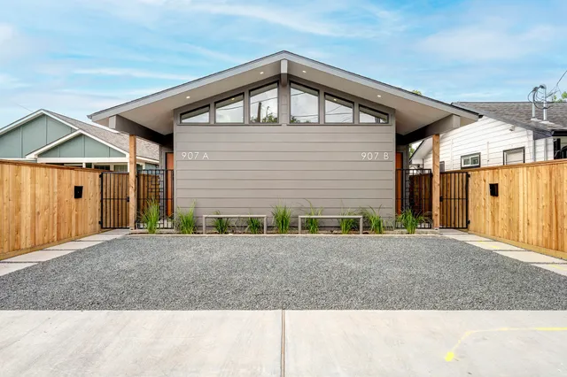 a front view of a house with garage