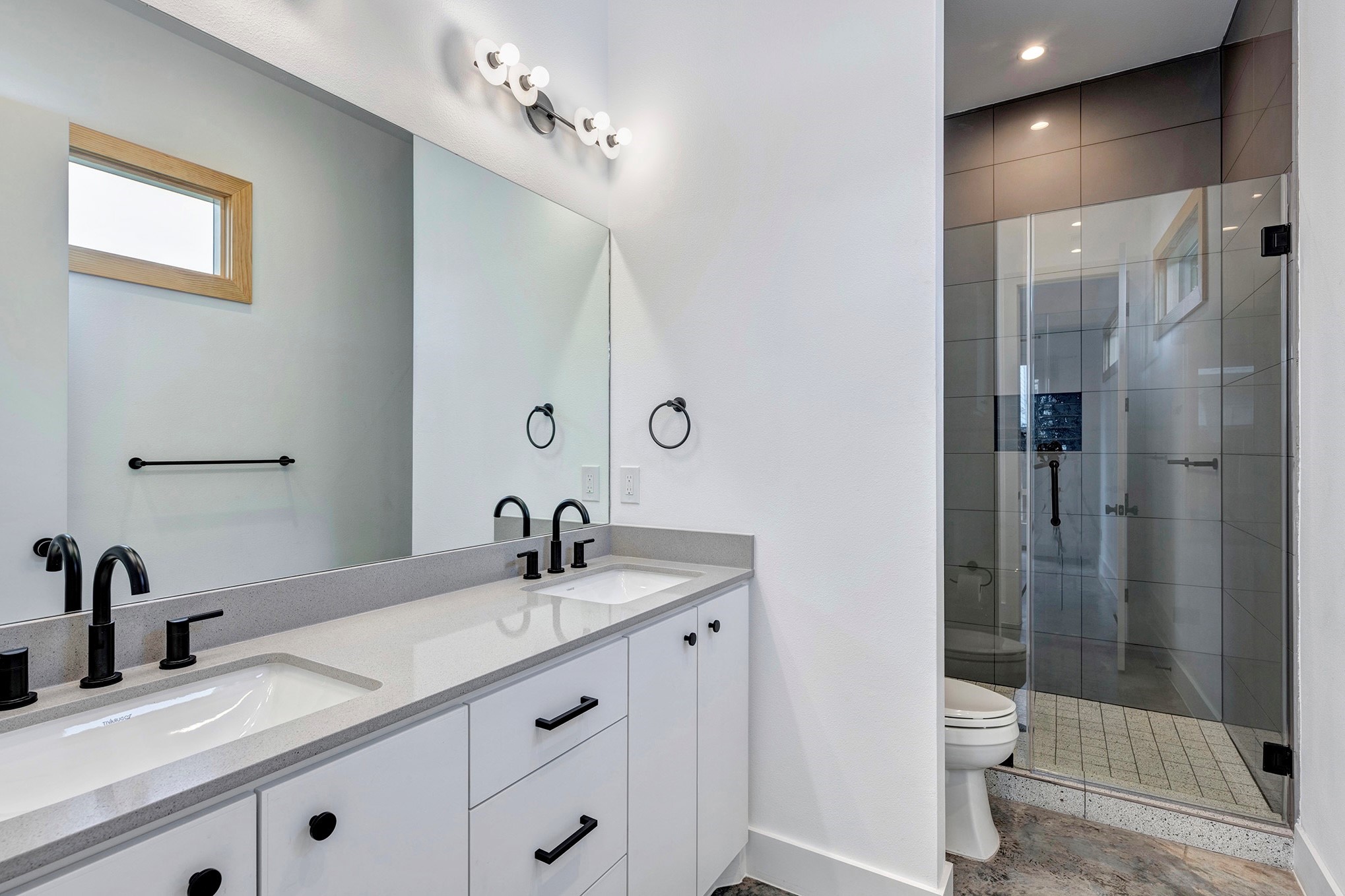 907 Kern Street, Unit A Houston, TX 77009 - Photo 8 of 18 Primary bathroom boasts double sinks, granite counter and walk-in shower.