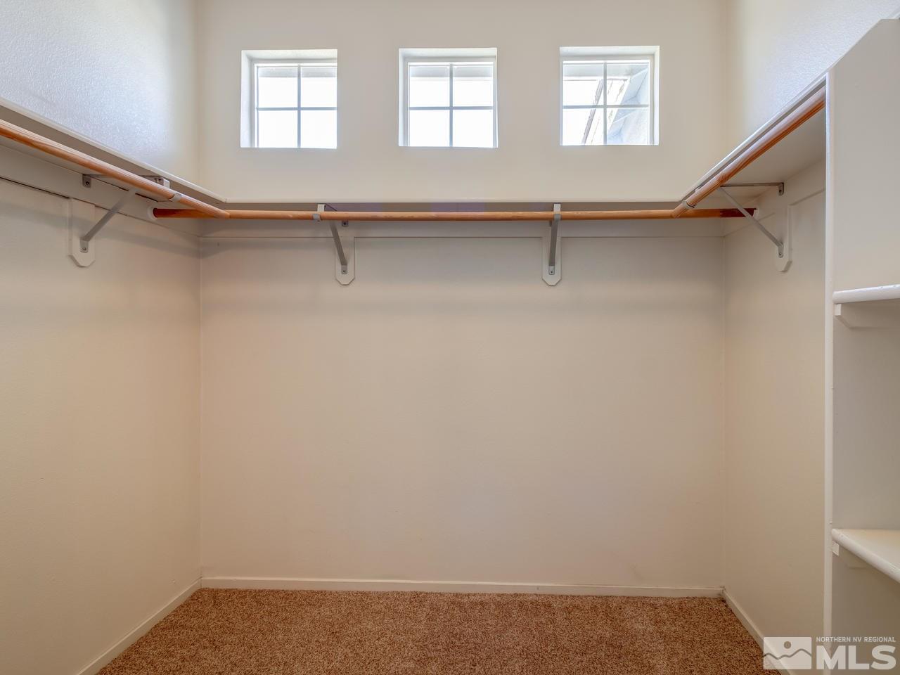 9647 Truckee Meadows Place Reno, NV 89521 - Photo 14 of 25 a view of a room with racks on the wall