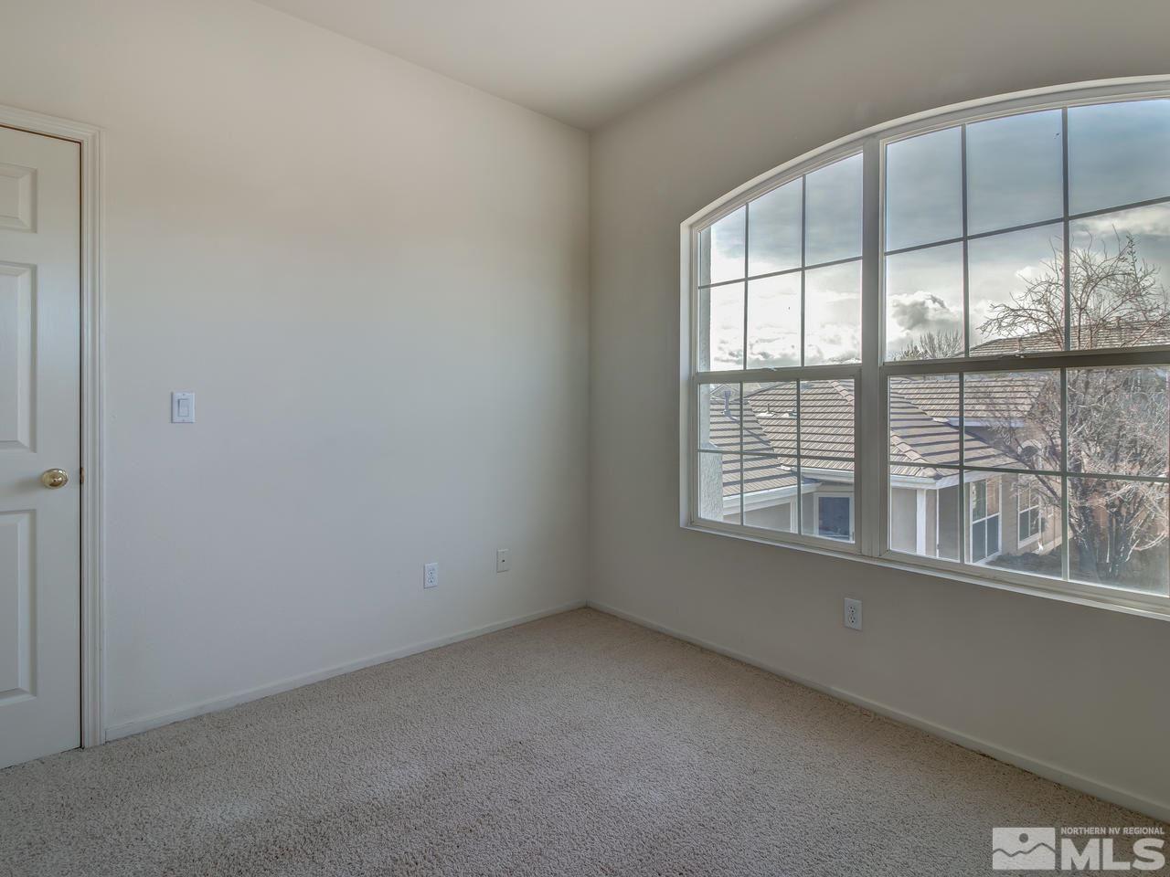 9647 Truckee Meadows Place Reno, NV 89521 - Photo 16 of 25 an empty room with a window