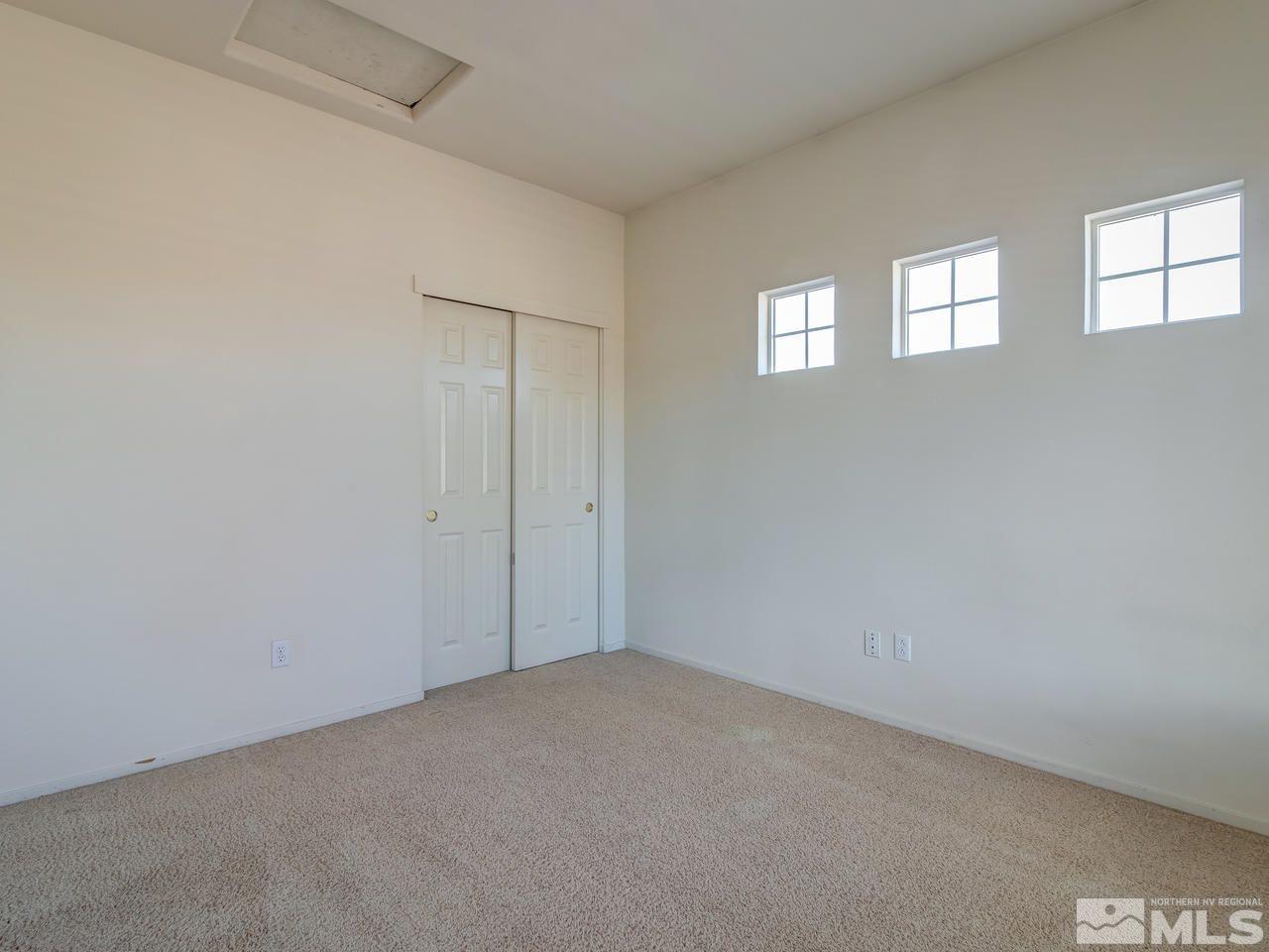 9647 Truckee Meadows Place Reno, NV 89521 - Photo 18 of 25 a view of an empty room with windows