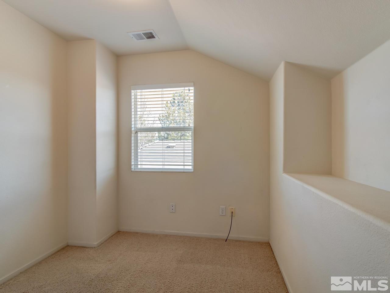 9647 Truckee Meadows Place Reno, NV 89521 - Photo 19 of 25 an empty room with a window