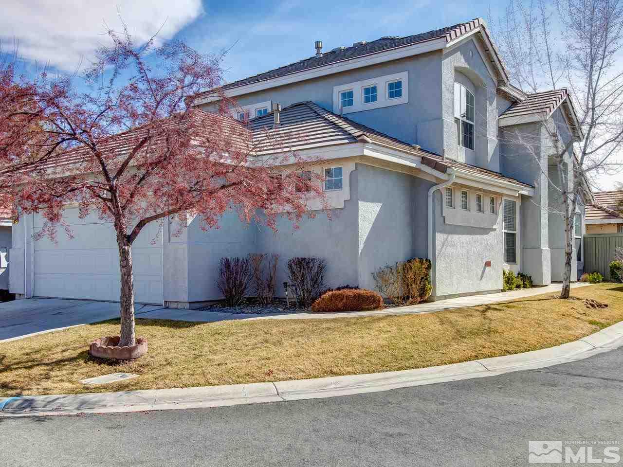 9647 Truckee Meadows Place Reno, NV 89521 - Photo 2 of 25 a front view of a house with a yard