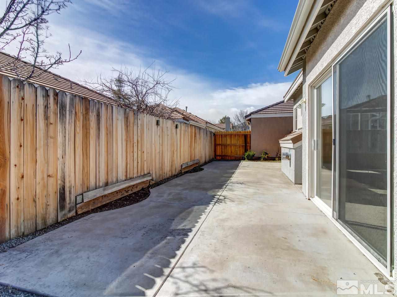 9647 Truckee Meadows Place Reno, NV 89521 - Photo 23 of 25 a view of a back yard of the house