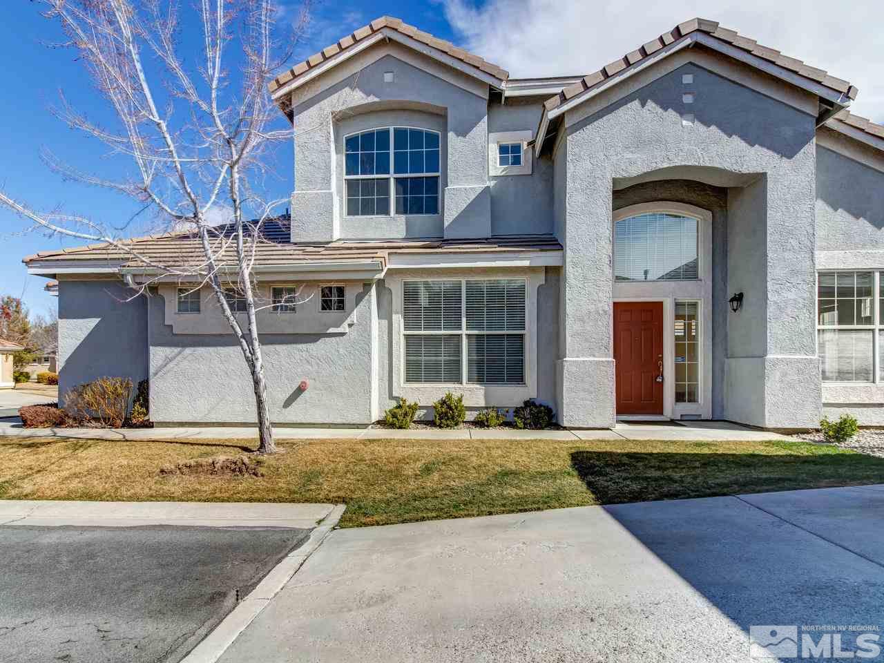 9647 Truckee Meadows Place Reno, NV 89521 - Photo 3 of 25 a front view of a house with a yard