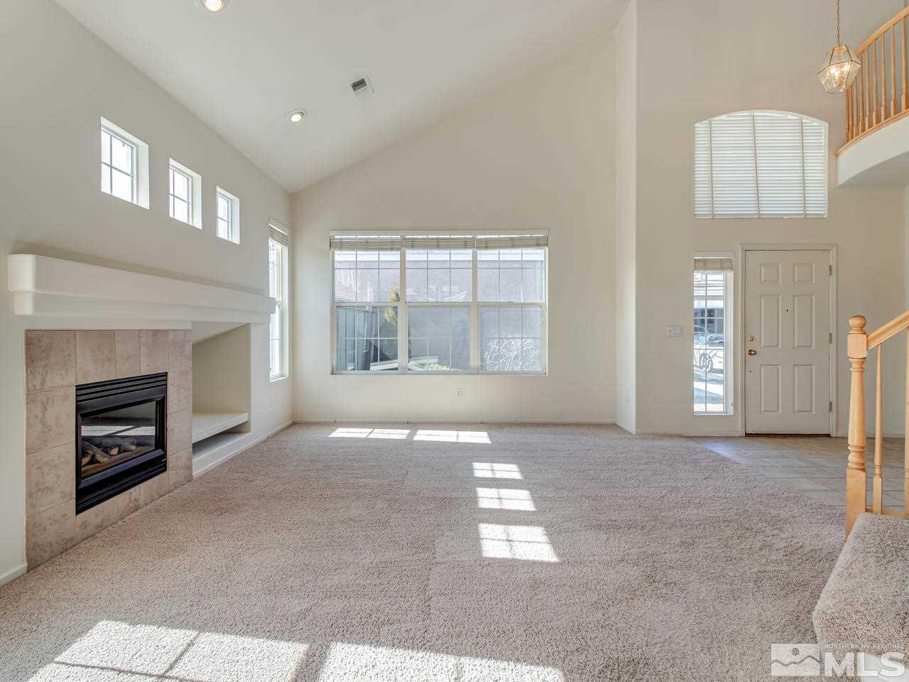 9647 Truckee Meadows Place Reno, NV 89521 - Photo 5 of 25 a view of livingroom and a fireplace