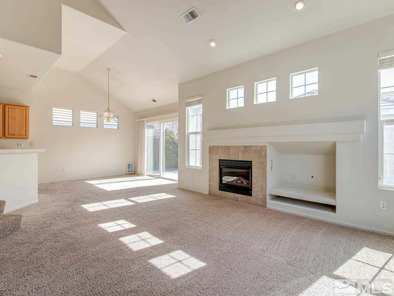 9647 Truckee Meadows Place Reno, NV 89521 - Photo 6 of 25 a view of a livingroom with a fireplace