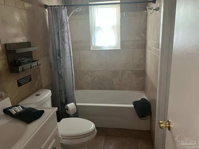 a bedroom with a bed and a mirror