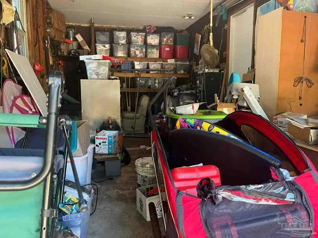 a view of a patio with a table and chairs