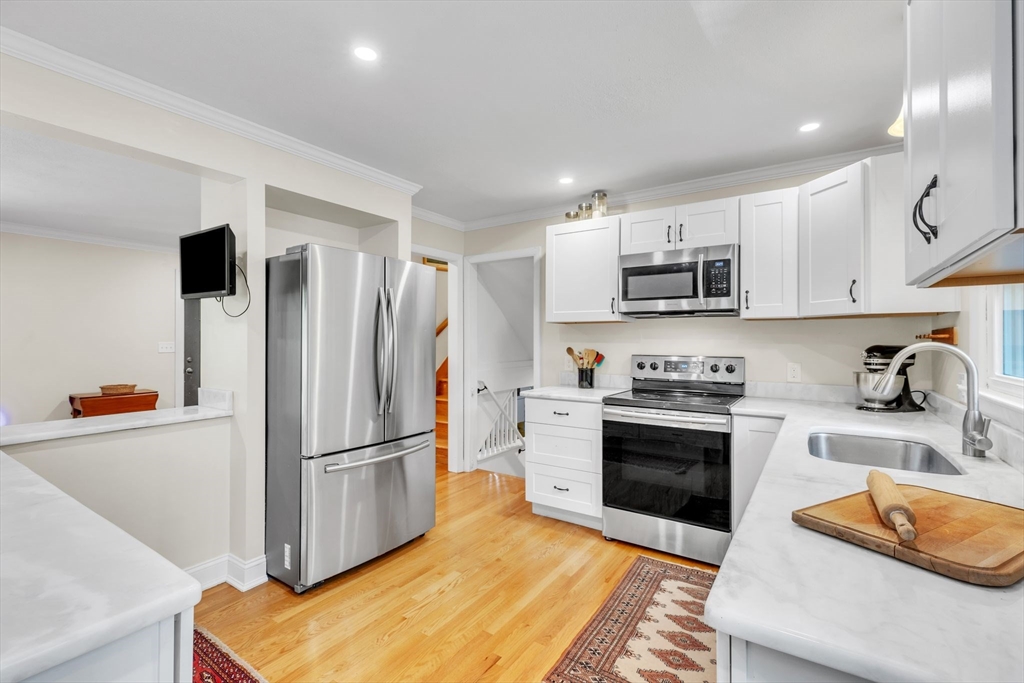 4 Colonial Road Sutton, MA 01590 - Photo 14 of 38 a kitchen with stainless steel appliances granite countertop a refrigerator sink and microwave
