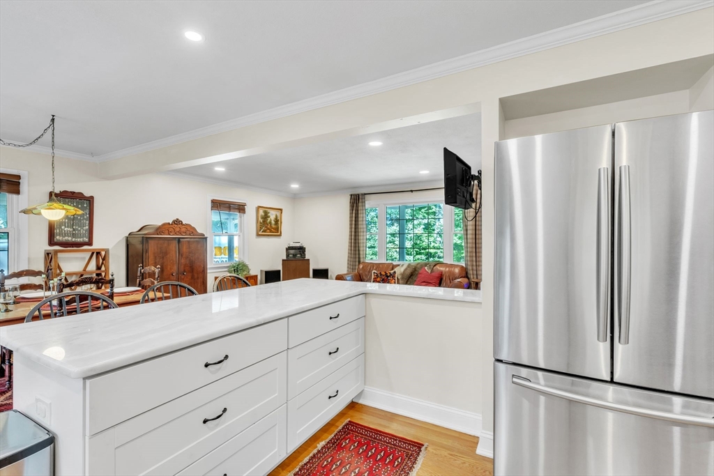 4 Colonial Road Sutton, MA 01590 - Photo 17 of 38 a kitchen with a refrigerator and a sink