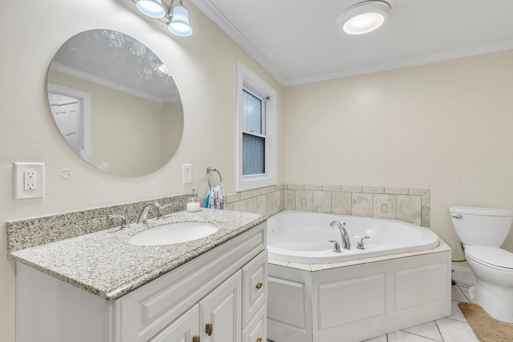 4 Colonial Road Sutton, MA 01590 - Photo 26 of 38 a bathroom with a granite countertop sink and a mirror