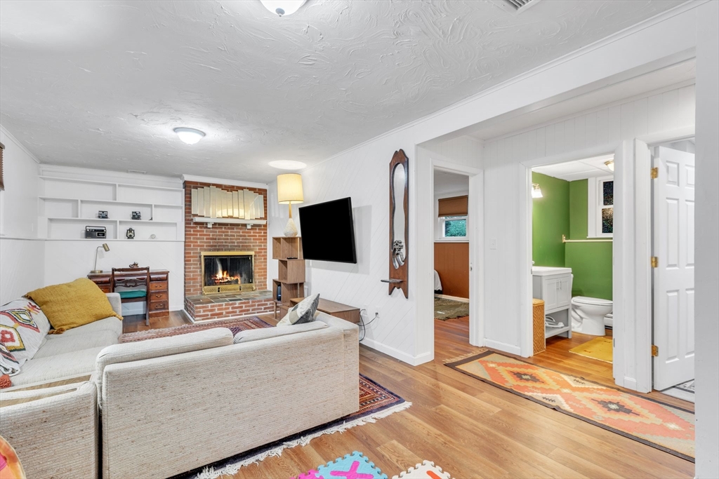 4 Colonial Road Sutton, MA 01590 - Photo 29 of 38 a living room with furniture and a flat screen tv