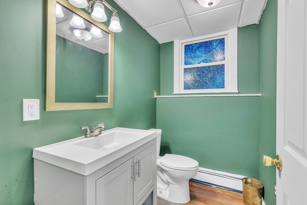 4 Colonial Road Sutton, MA 01590 - Photo 31 of 38 a bathroom with a toilet sink and mirror