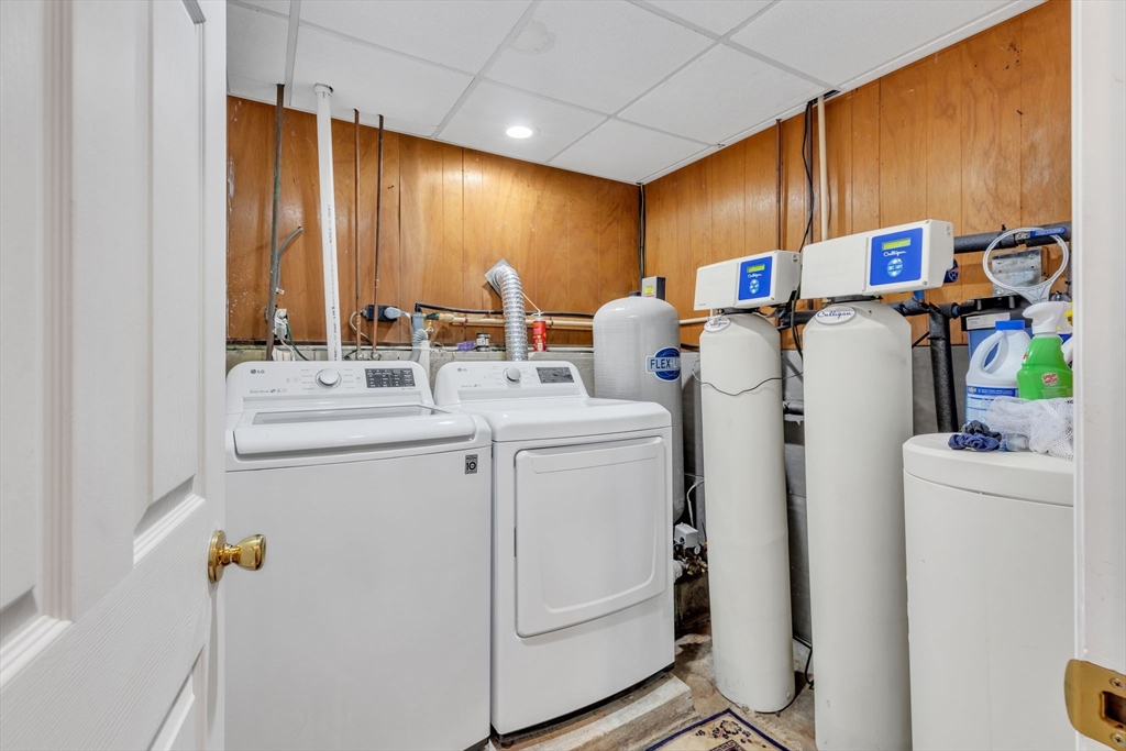 4 Colonial Road Sutton, MA 01590 - Photo 33 of 38 a view of storage and utility room with washer and dryer
