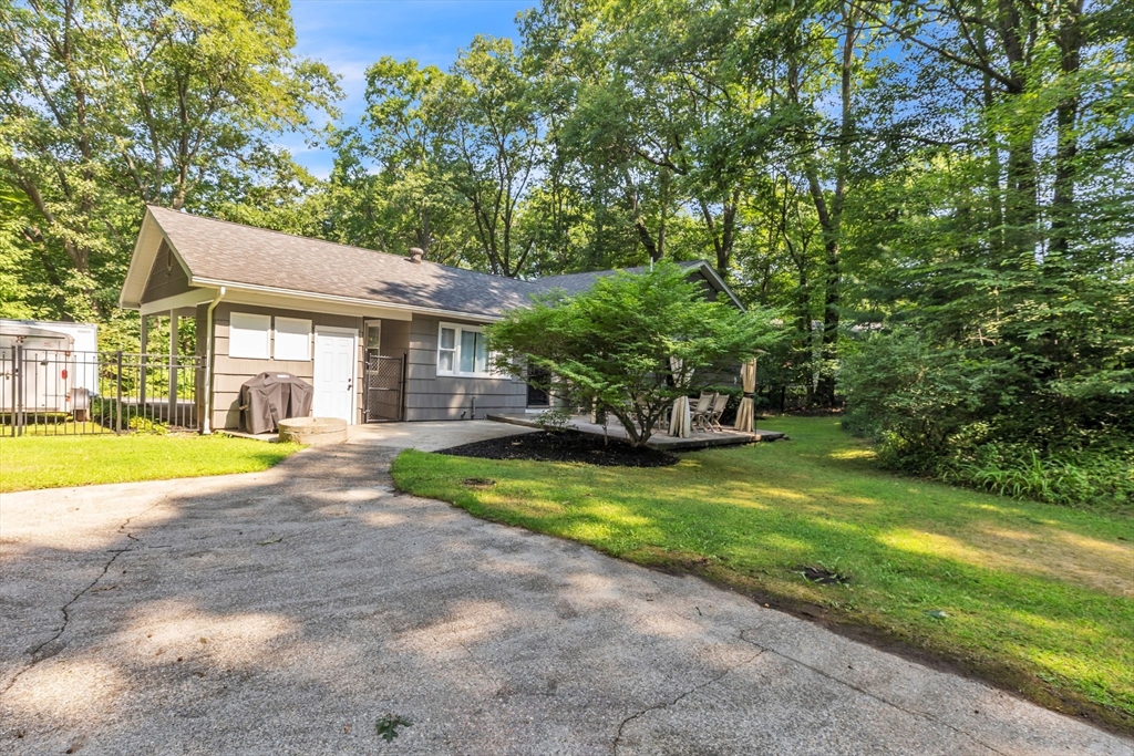4 Colonial Road Sutton, MA 01590 - Photo 36 of 38 a view of house with outdoor space and swimming pool