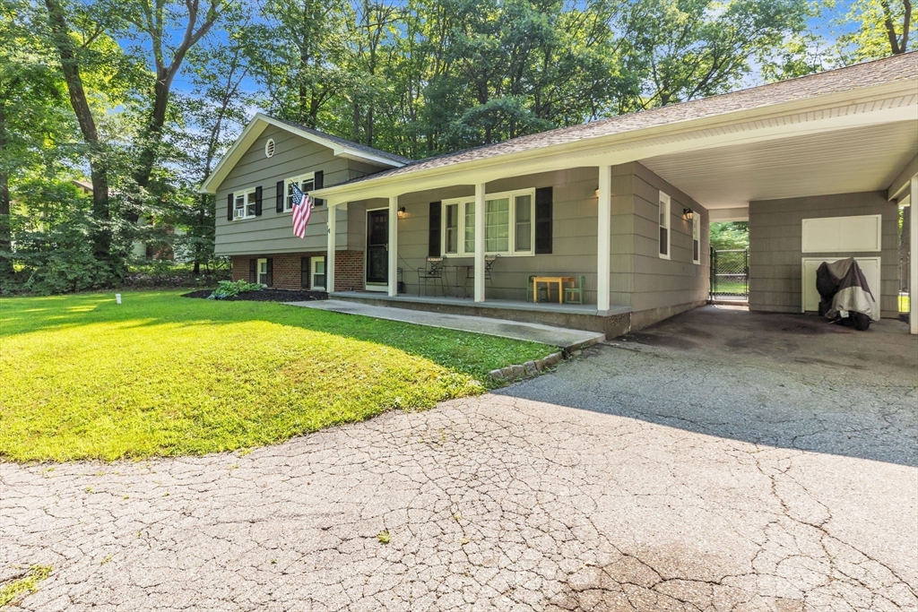 4 Colonial Road Sutton, MA 01590 - Photo 4 of 38 a view of a house with a swimming pool