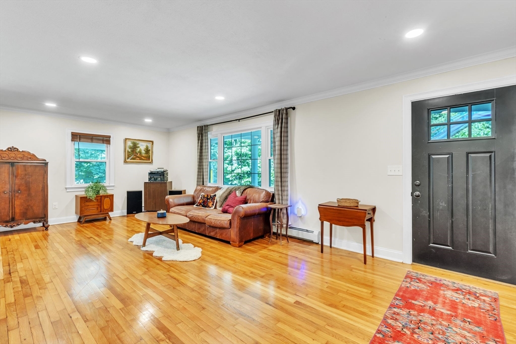4 Colonial Road Sutton, MA 01590 - Photo 7 of 38 a living room with furniture and a window