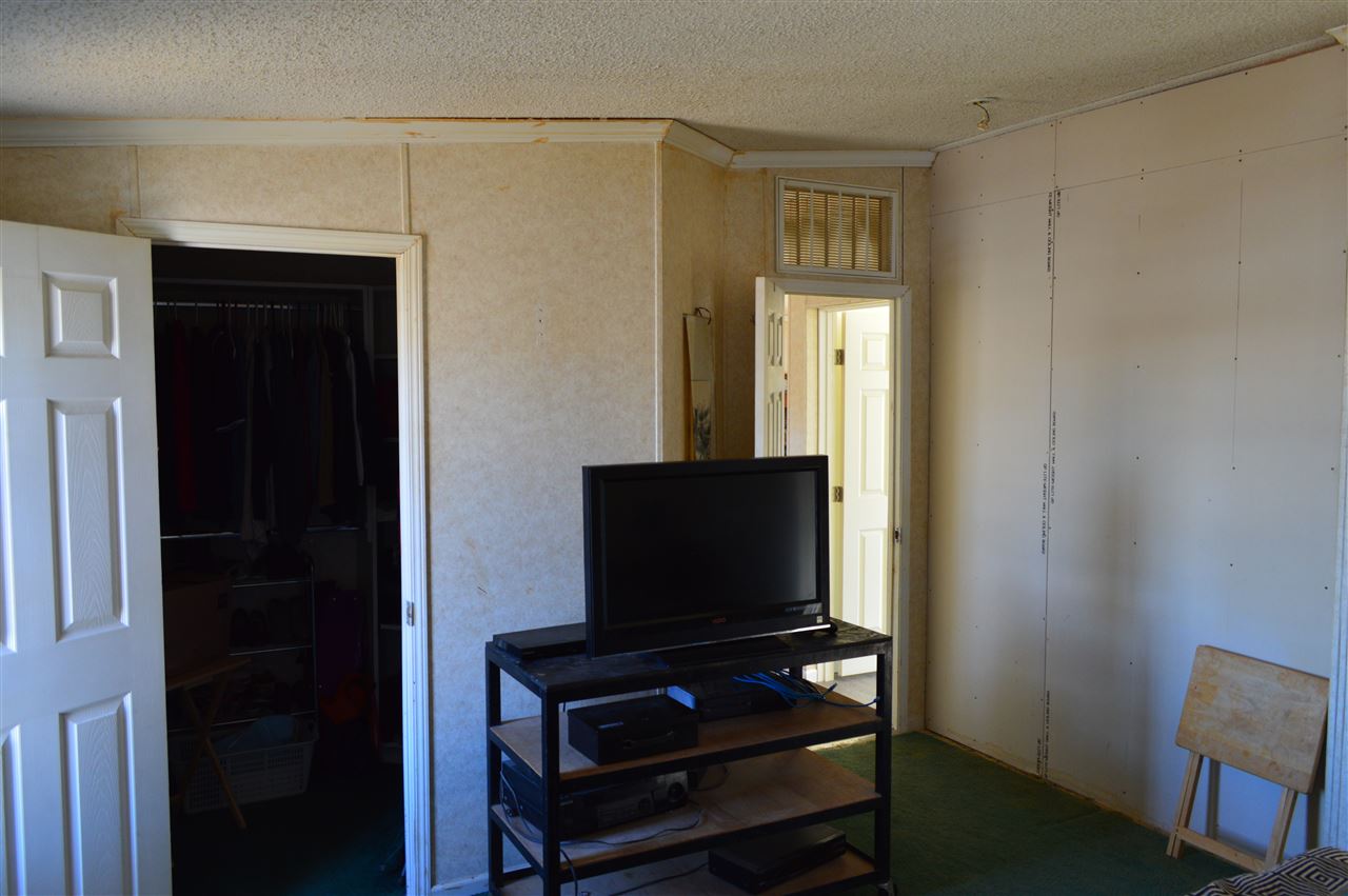 564 39 Road Palisade, CO 81526 - Photo 17 of 22 a living room with furniture and a flat screen tv