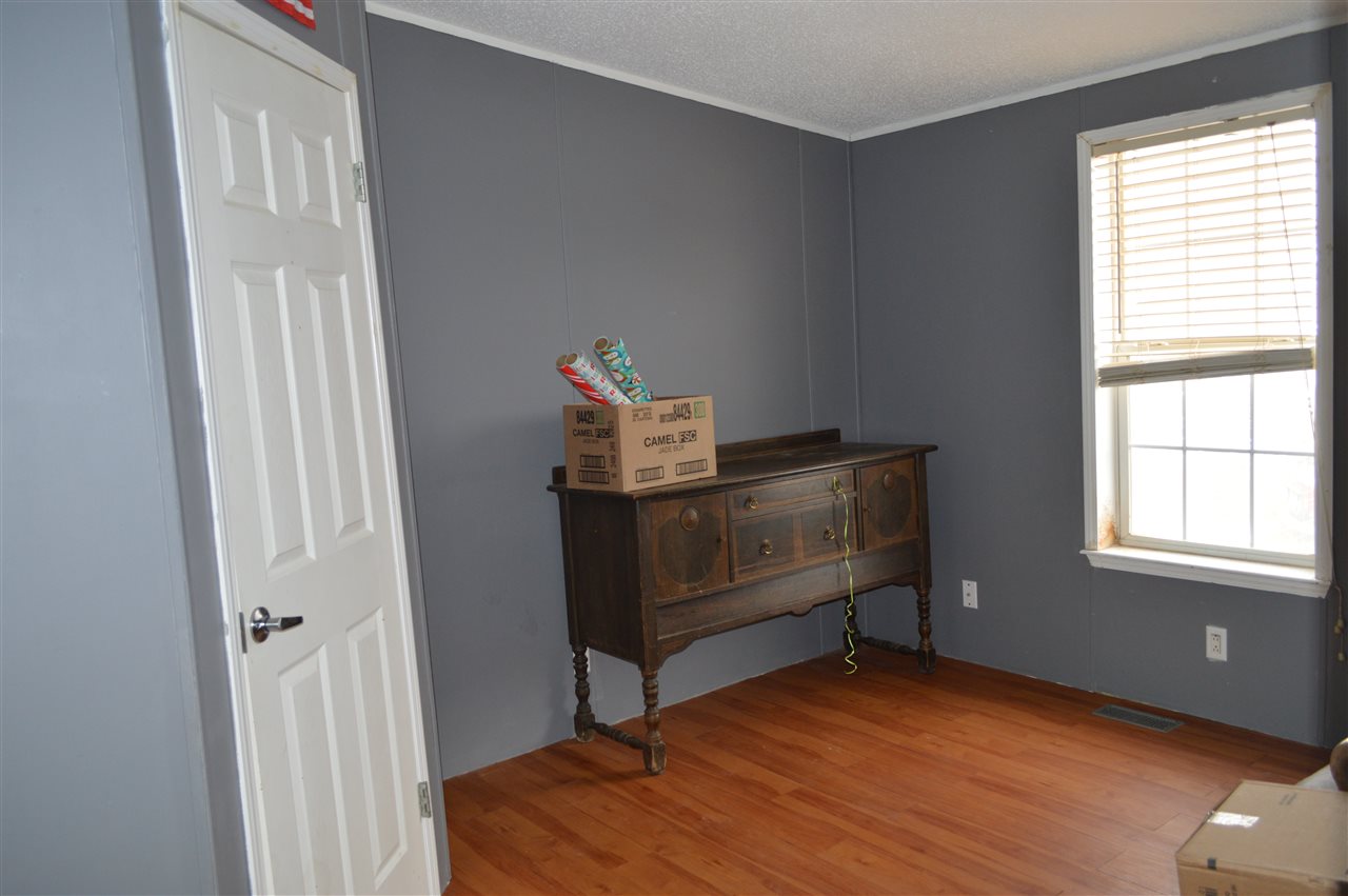 564 39 Road Palisade, CO 81526 - Photo 7 of 22 a view of room with window and wooden floor