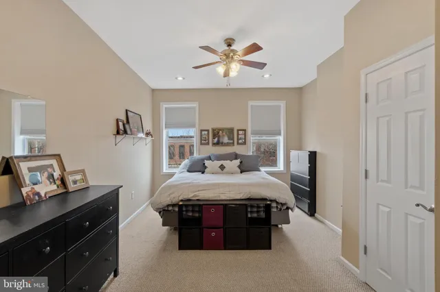 a bed room with a bed and a chandelier