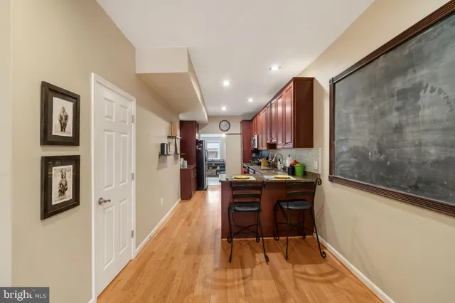 a kitchen with stainless steel appliances granite countertop refrigerator sink and stove