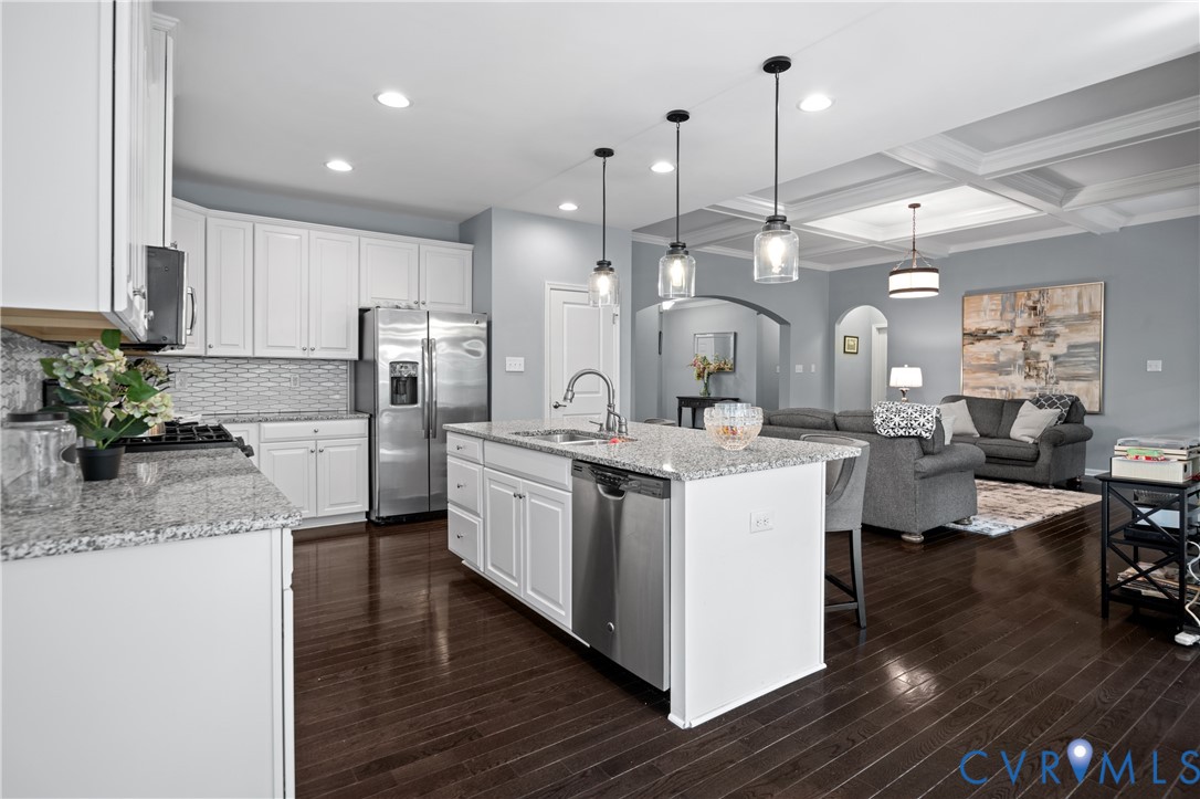 1012 Water Beech Road Midlothian, VA 23114 - Photo 11 of 47 a large white kitchen with lots of counter space a sink refrigerator and cabinets