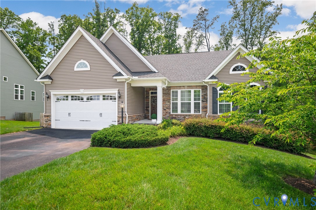 1012 Water Beech Road Midlothian, VA 23114 - Photo 2 of 47 a front view of a house with a yard and garage