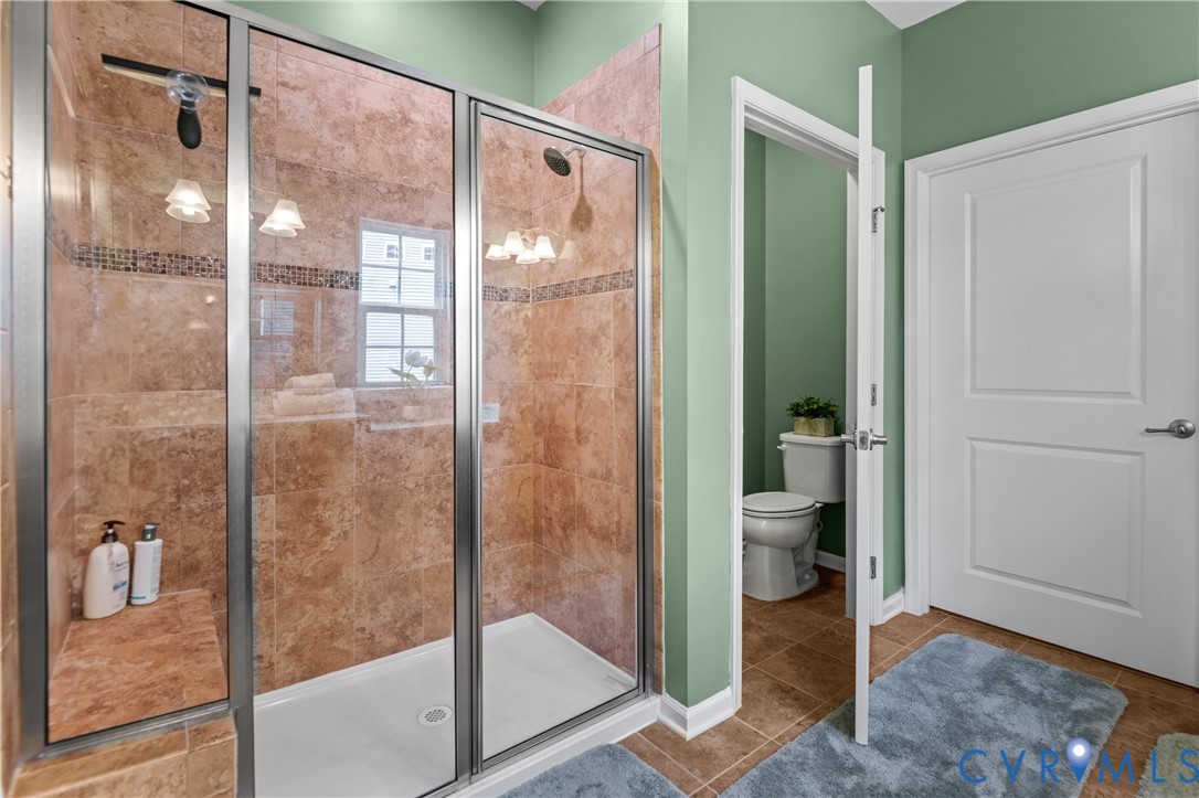 1012 Water Beech Road Midlothian, VA 23114 - Photo 24 of 47 a bathroom with a glass shower door