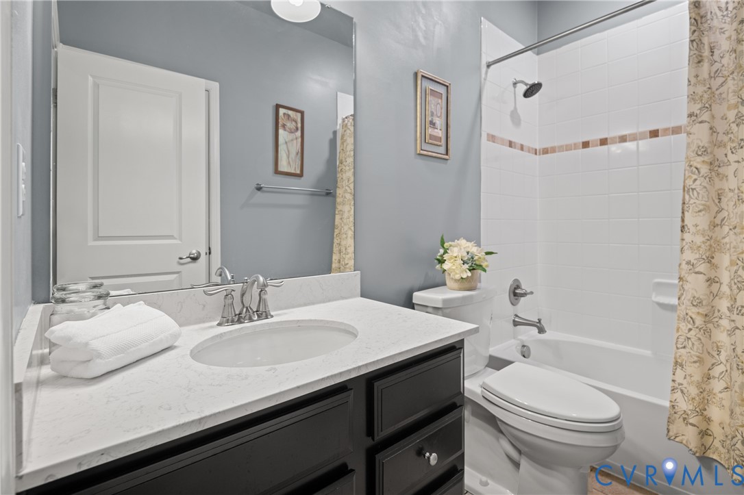 1012 Water Beech Road Midlothian, VA 23114 - Photo 26 of 47 a bathroom with a sink toilet and shower