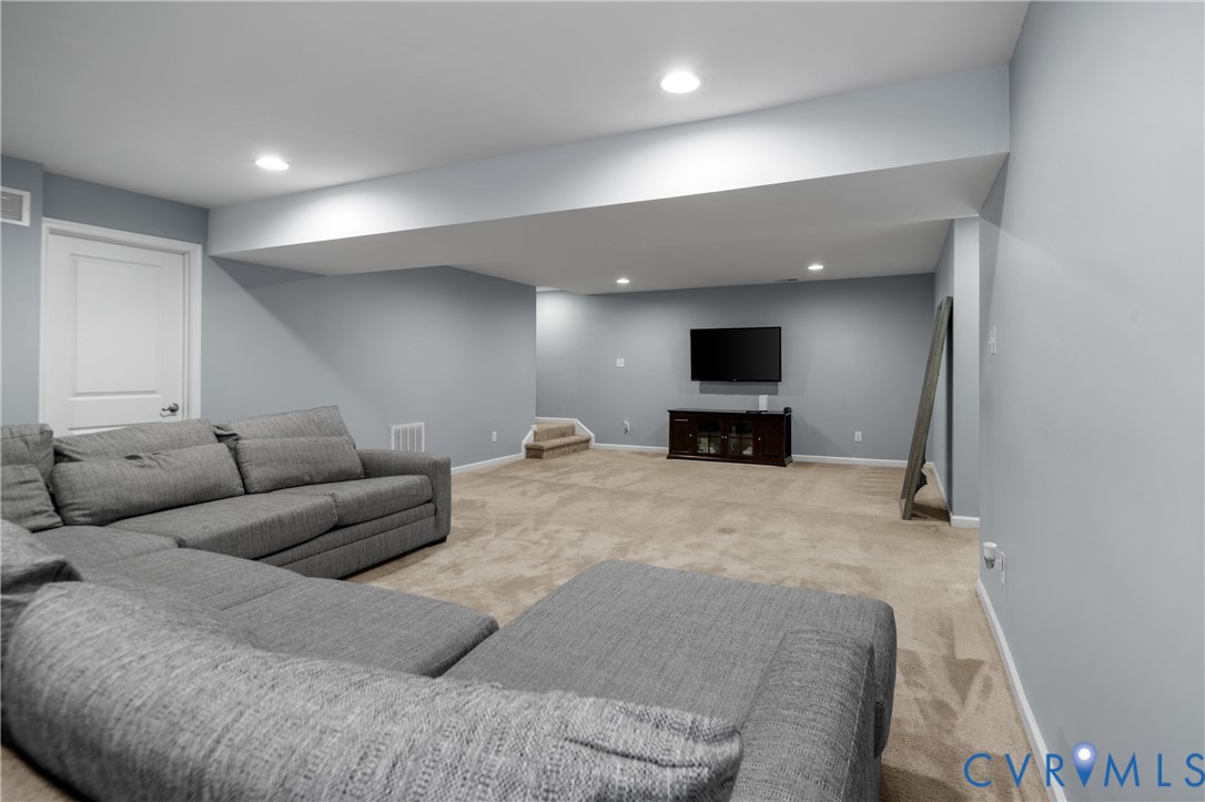 1012 Water Beech Road Midlothian, VA 23114 - Photo 30 of 47 a living room with furniture and a flat screen tv