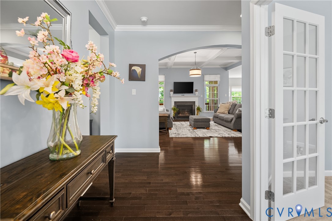 1012 Water Beech Road Midlothian, VA 23114 - Photo 3 of 47 a dining room with furniture a chandelier and wooden floor
