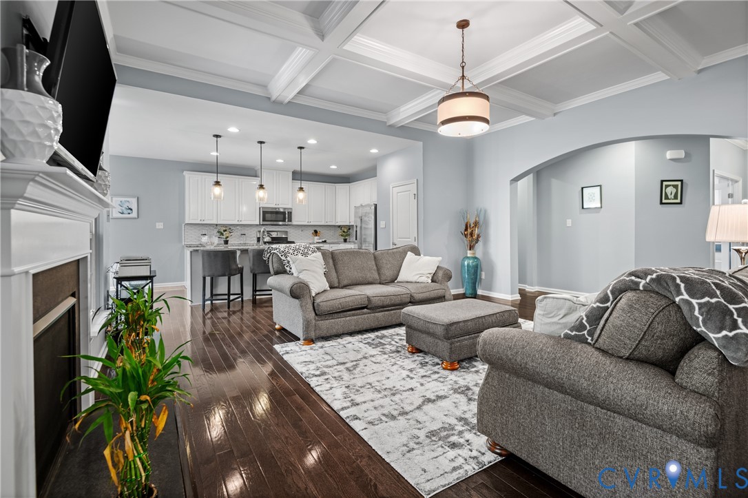 1012 Water Beech Road Midlothian, VA 23114 - Photo 7 of 47 a living room with furniture kitchen view and a chandelier