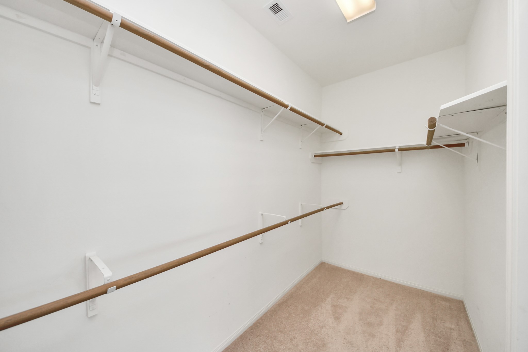 5815 Pheasant Ridge Lane Houston, TX 77041 - Photo 44 of 46 Spacious walk-in closet featuring ample hanging space and shelving, perfect for organizing your wardrobe essentials.