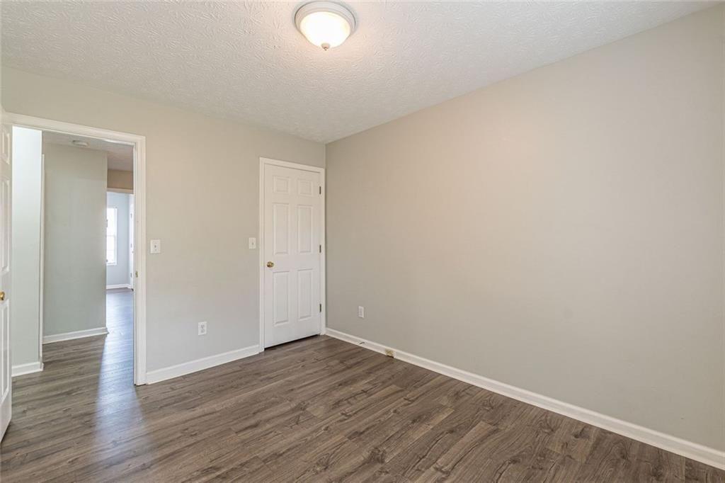 3151 Kingswood Glen Decatur, GA 30034 - Photo 31 of 38 a view of an empty room with wooden floor