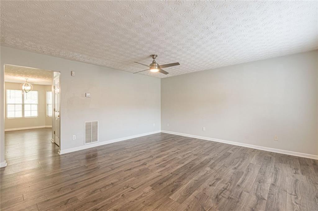 3151 Kingswood Glen Decatur, GA 30034 - Photo 4 of 38 wooden floor in an empty room with a window